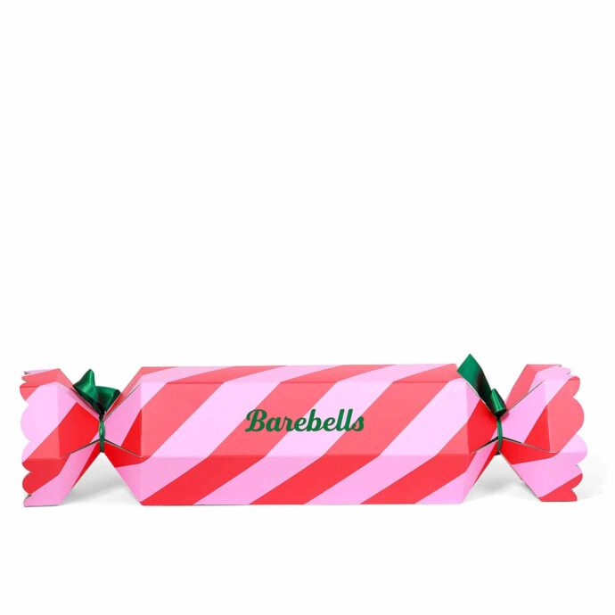 Expo-box "Barebells" med formen av en smällkaramell.